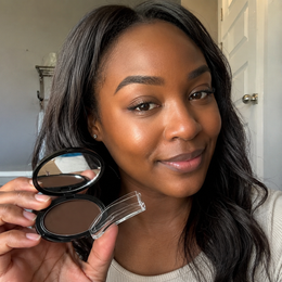 Customer holding the Lelixa Brow Stamp compact